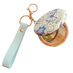 Espelho Redondo acabamentos em metal Rose alça em courino Azul Claro- Flores